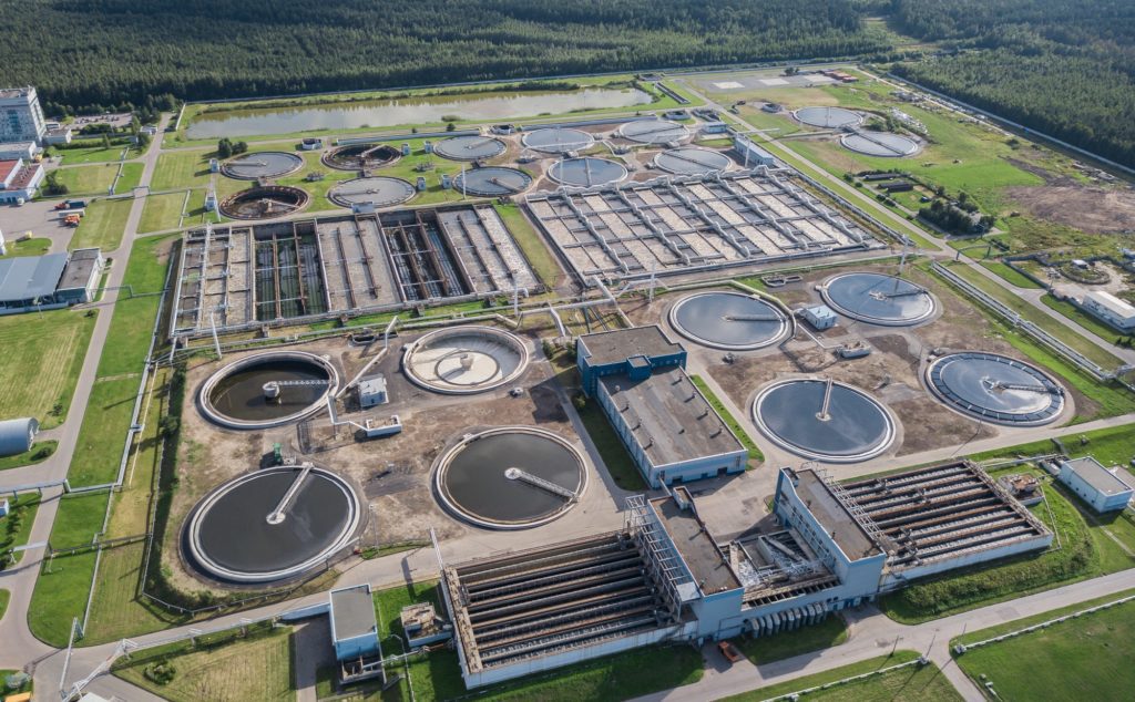 Aerial view of wastewater industry facility showing tanks and buildings